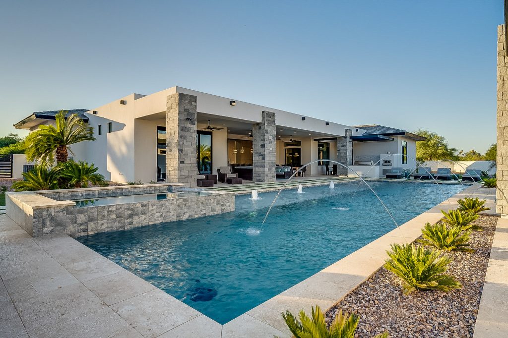 Inspiration for a southwestern backyard rectangular lap pool fountain remodel in Phoenix