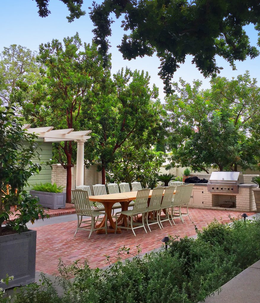 Inspiration for a timeless backyard brick patio kitchen remodel with no cover