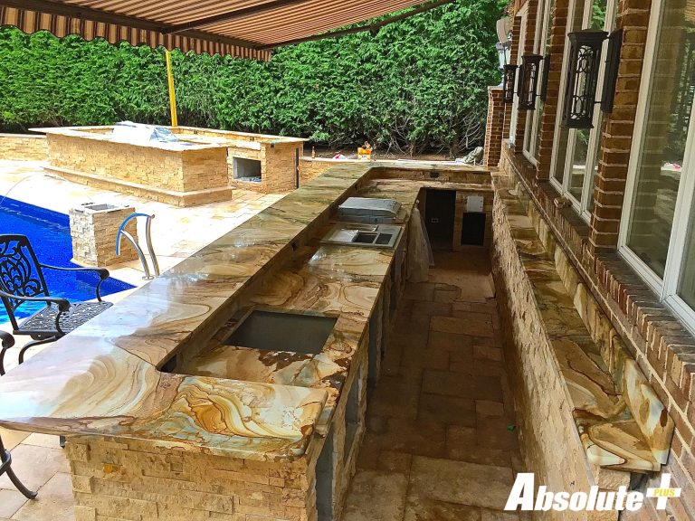 Inspiration for a timeless backyard patio kitchen remodel in New York with an awning