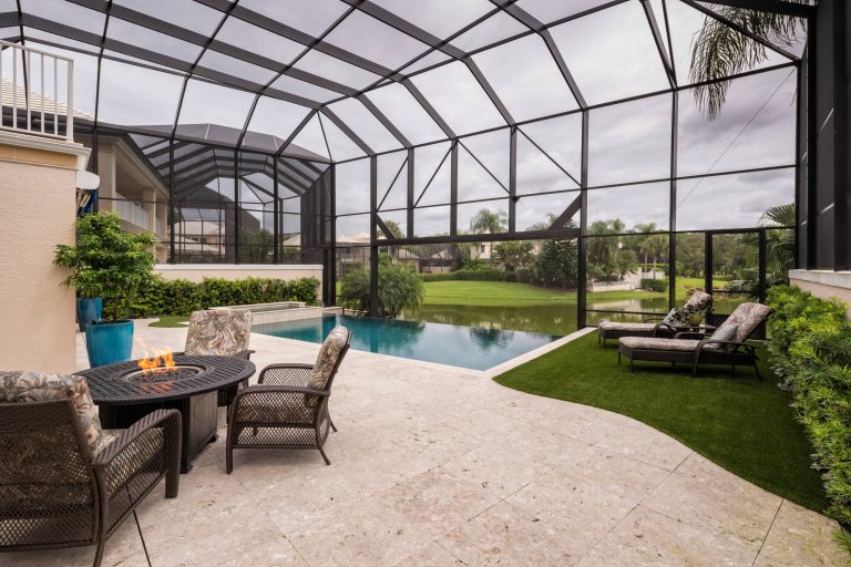 Inspiration for a timeless backyard rectangular infinity pool remodel in Miami