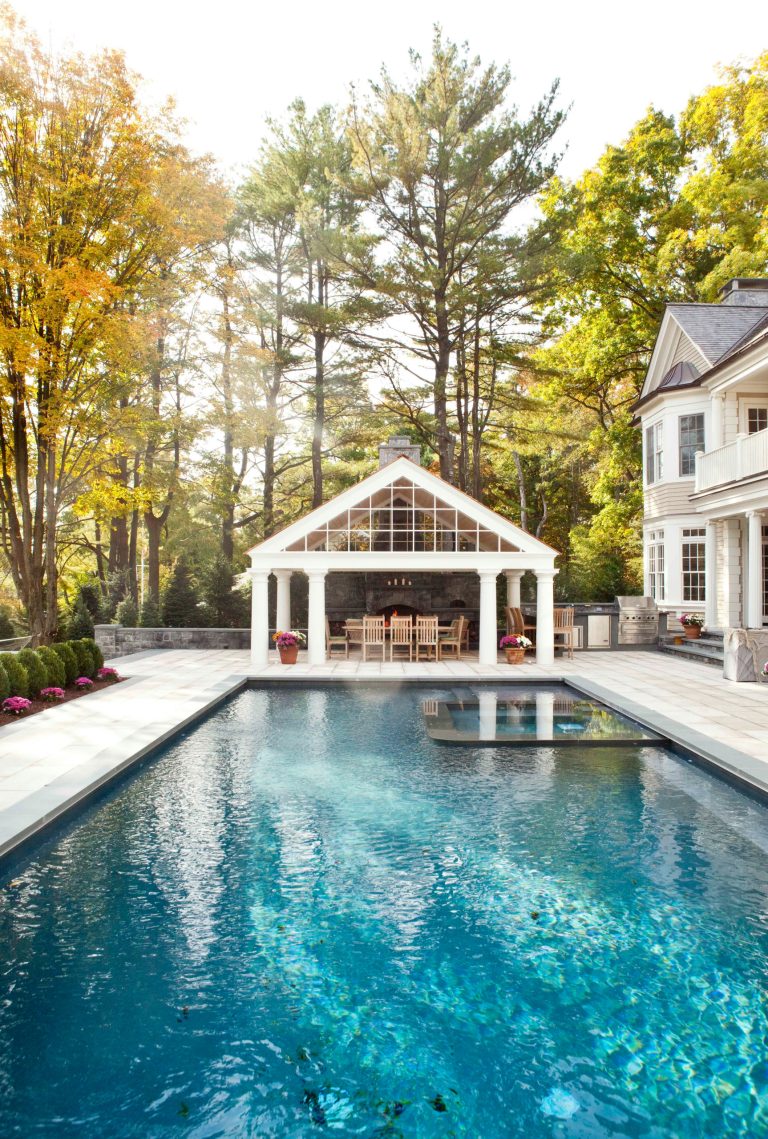 Inspiration for a timeless backyard stone and rectangular lap pool house remodel in New York