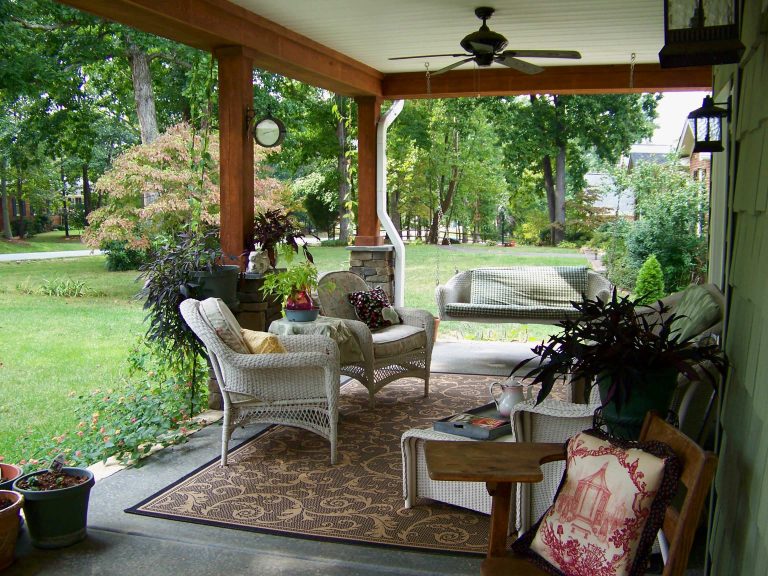 Inspiration for a timeless concrete porch remodel in Other with a roof extension by Anna Looper | Outdoor Photos | Porch | Landscaping | Landscape Design | Outdoor Living Space | Porch Design Ideas | Outdoor Living Space Ideas | Backyard Design