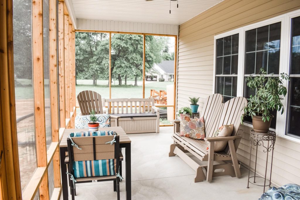 Inspiration for a timeless concrete screened-in porch remodel in Other with a roof extension by Cornerstone Builders of Terre Haute, Inc. | Outdoor Photos | Porch | Landscaping | Landscape Design | Outdoor Living Space | Porch Design Ideas | Outdoor Living Space Ideas | Backyard Design