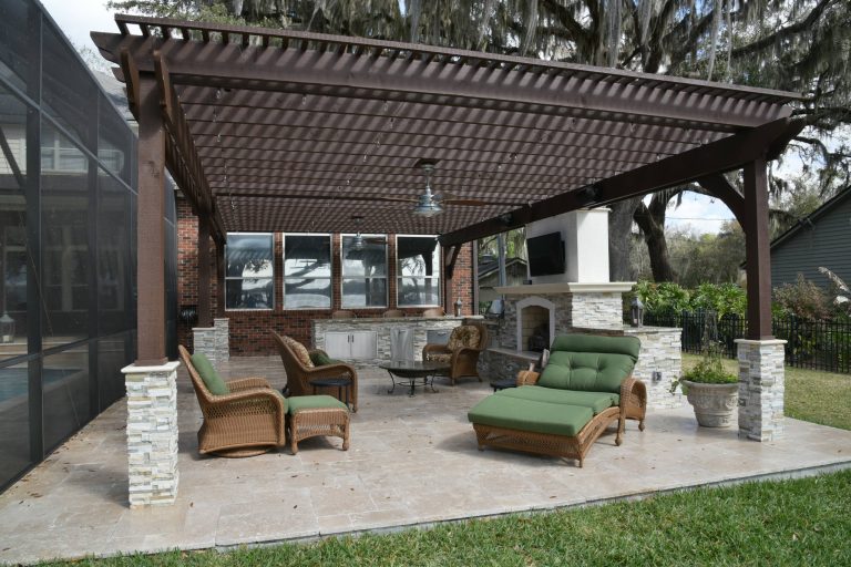 Inspiration for a timeless outdoor kitchen deck remodel in Jacksonville with a pergola