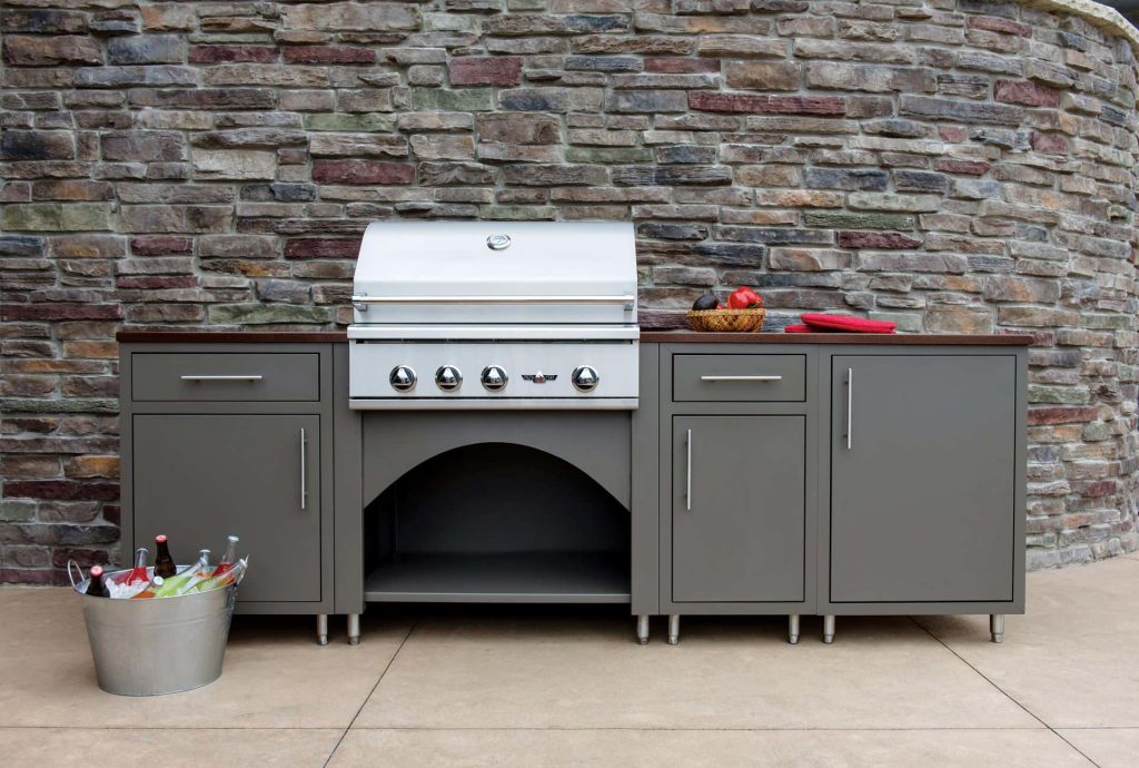 Inspiration for a timeless side yard stamped concrete patio kitchen remodel in Other with no cover