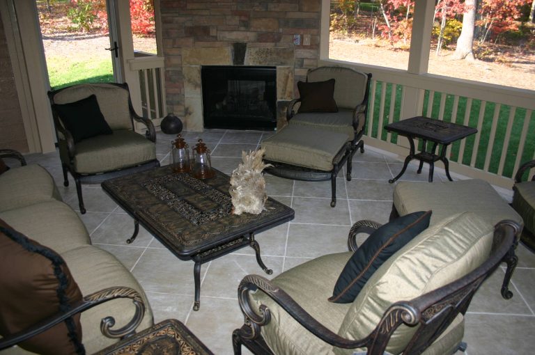 Inspiration for a timeless tile back porch remodel in Raleigh with a roof extension by InsideOut Construction, Inc. | Outdoor Photos | Porch | Landscaping | Landscape Design | Outdoor Living Space | Porch Design Ideas | Outdoor Living Space Ideas | Backyard Design