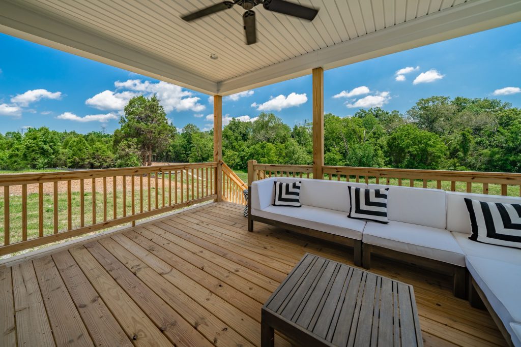 Inspiration for a transitional back porch remodel in Huntington with decking and a roof extension by Bentley Construction LLC | Outdoor Photos | Porch | Landscaping | Landscape Design | Outdoor Living Space | Porch Design Ideas | Outdoor Living Space Ideas | Backyard Design