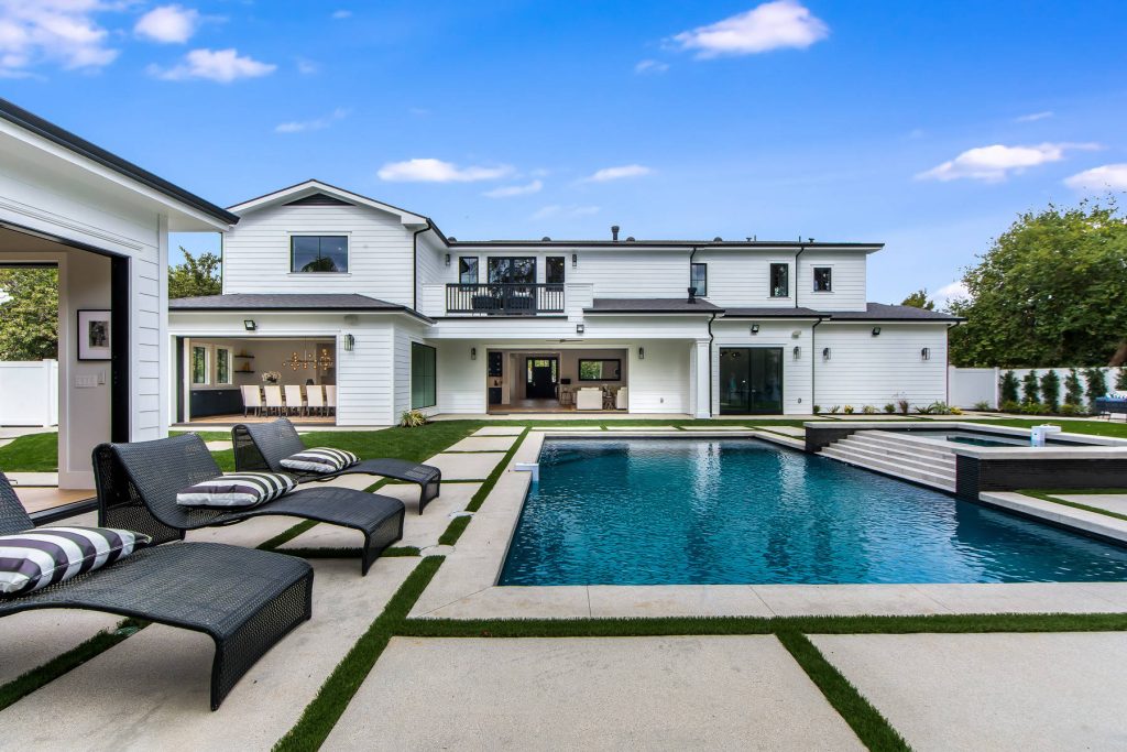 Inspiration for a transitional backyard concrete and rectangular lap hot tub remodel in Los Angeles