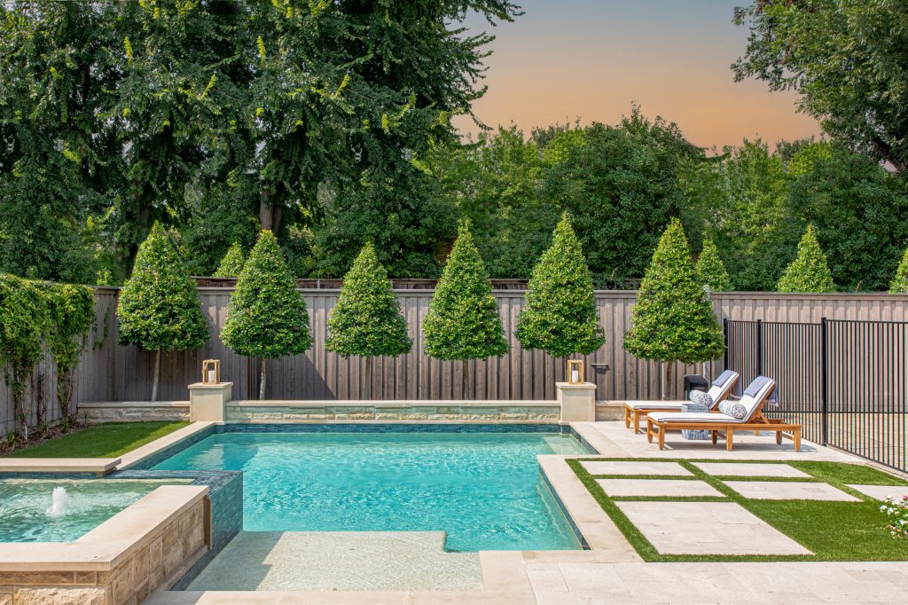 Inspiration for a transitional backyard concrete paver and custom-shaped hot tub remodel in Dallas