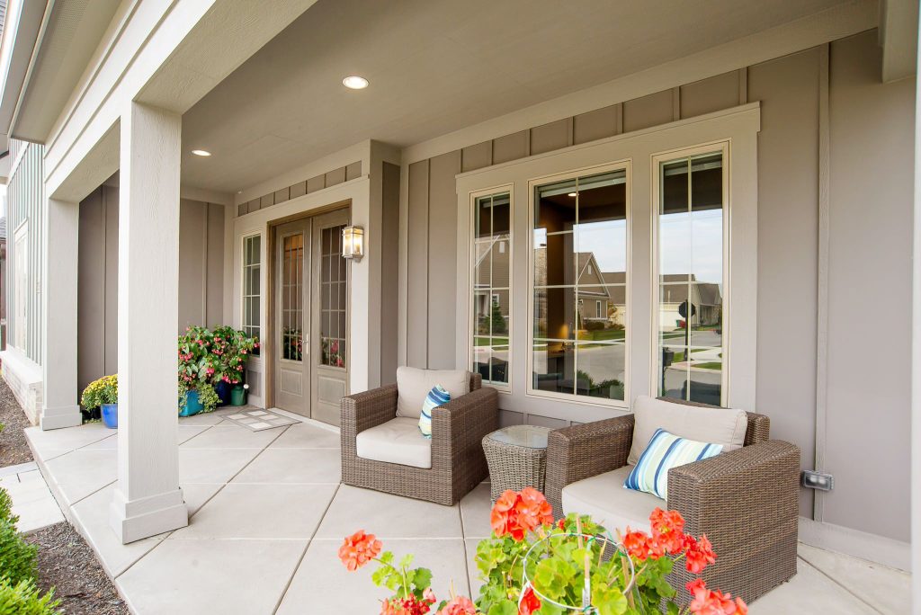 Inspiration for a transitional front porch remodel in Indianapolis with a roof extension by McKenzie Collection | Outdoor Photos | Porch | Landscaping | Landscape Design | Outdoor Living Space | Porch Design Ideas | Outdoor Living Space Ideas | Backyard Design