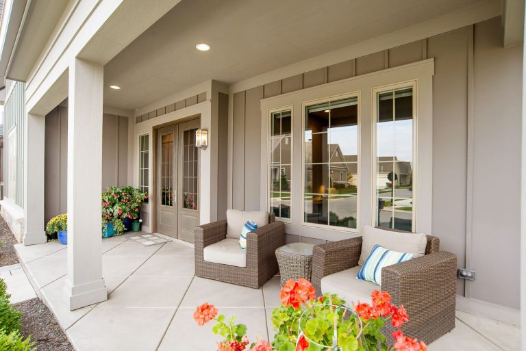 Inspiration for a transitional front porch remodel in Indianapolis with a roof extension by McKenzie Collection | Outdoor Photos | Porch | Landscaping | Landscape Design | Outdoor Living Space | Porch Design Ideas | Outdoor Living Space Ideas | Backyard Design