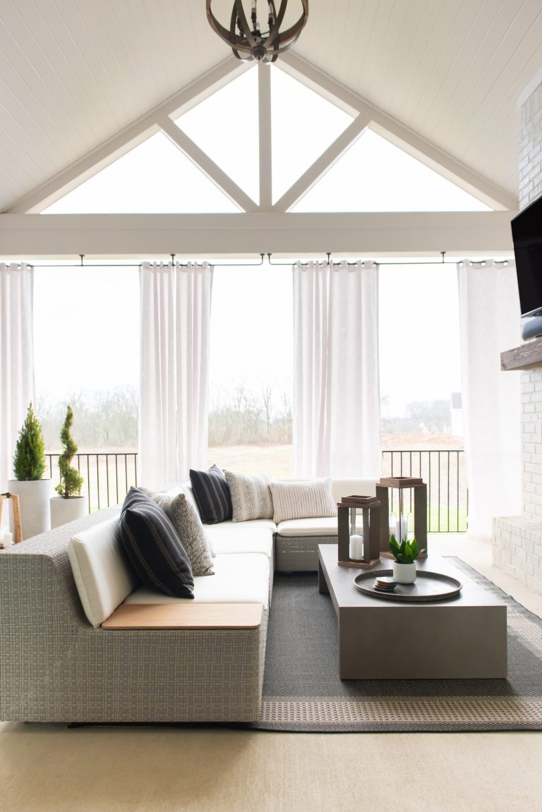 Inspiration for a transitional metal railing porch remodel in Nashville with a roof extension by ONYX & ALABASTER | Outdoor Photos | Porch | Landscaping | Landscape Design | Outdoor Living Space | Porch Design Ideas | Outdoor Living Space Ideas | Backyard Design