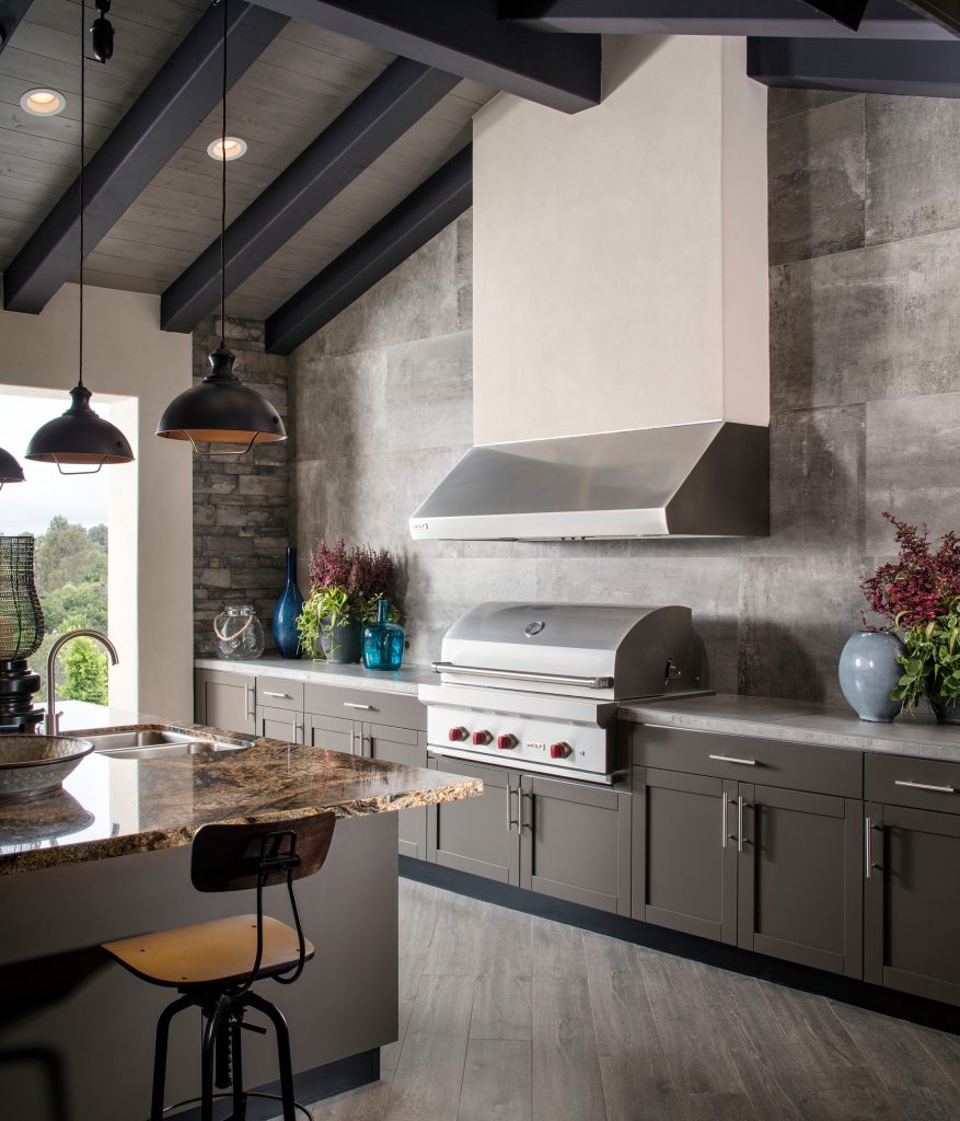 Inspiration for a transitional patio kitchen remodel in Miami with a roof extension