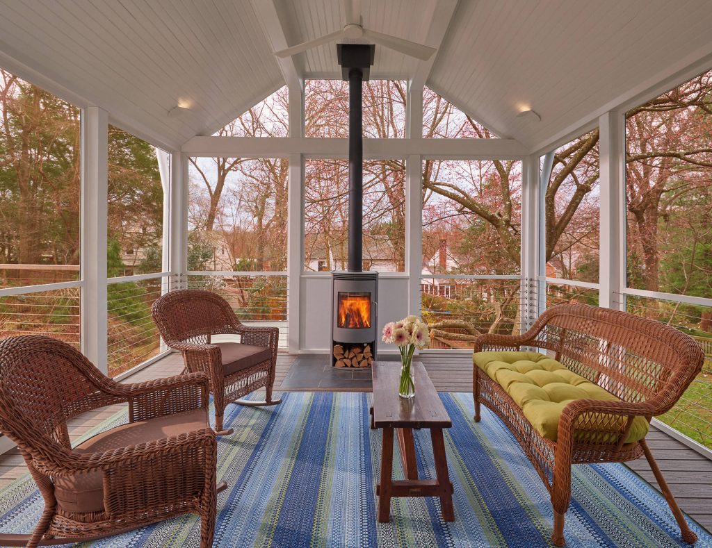 Inspiration for a transitional porch remodel in DC Metro with a fireplace and a roof extension by Balodemas Architects | Outdoor Photos | Porch | Landscaping | Landscape Design | Outdoor Living Space | Porch Design Ideas | Outdoor Living Space Ideas | Backyard Design