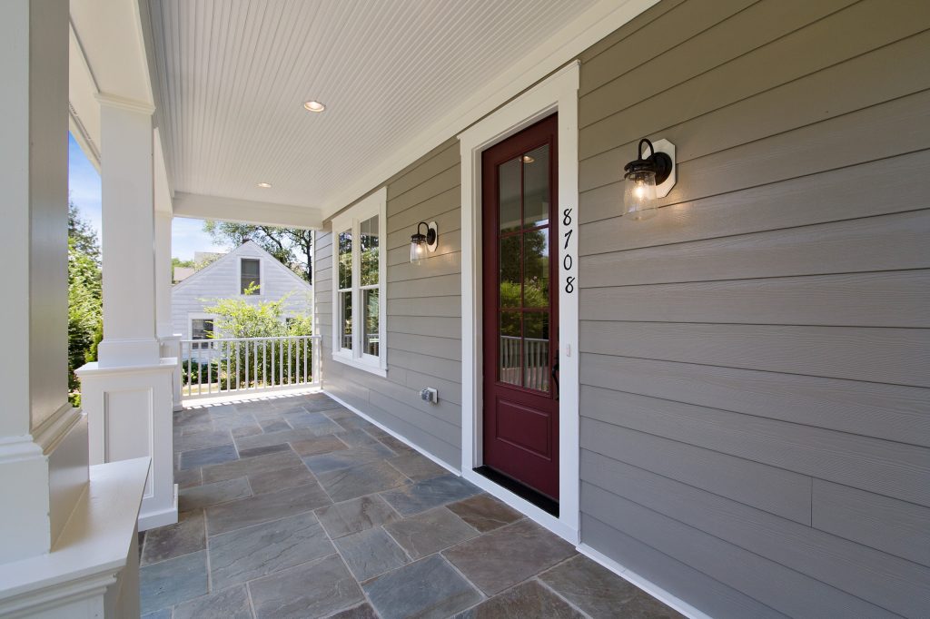 Inspiration for a transitional stone front porch remodel in DC Metro with a roof extension by Wakefield Homes, LC | Outdoor Photos | Porch | Landscaping | Landscape Design | Outdoor Living Space | Porch Design Ideas | Outdoor Living Space Ideas | Backyard Design