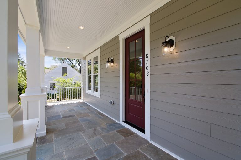 Inspiration for a transitional stone front porch remodel in DC Metro with a roof extension by Wakefield Homes, LC | Outdoor Photos | Porch | Landscaping | Landscape Design | Outdoor Living Space | Porch Design Ideas | Outdoor Living Space Ideas | Backyard Design