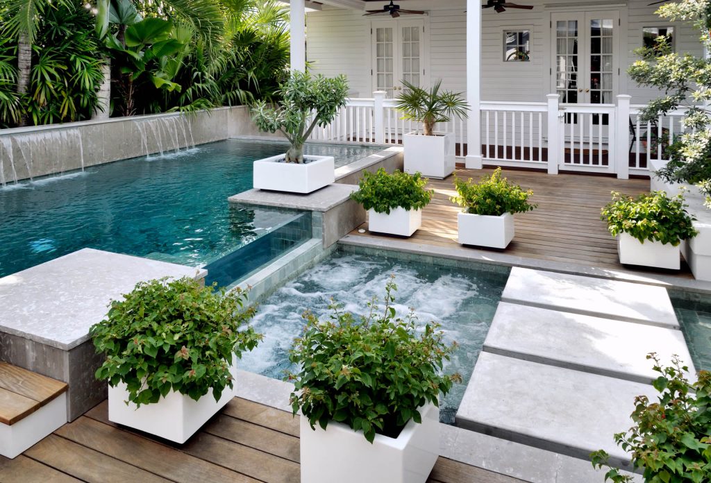 Inspiration for a tropical backyard rectangular pool remodel in Miami