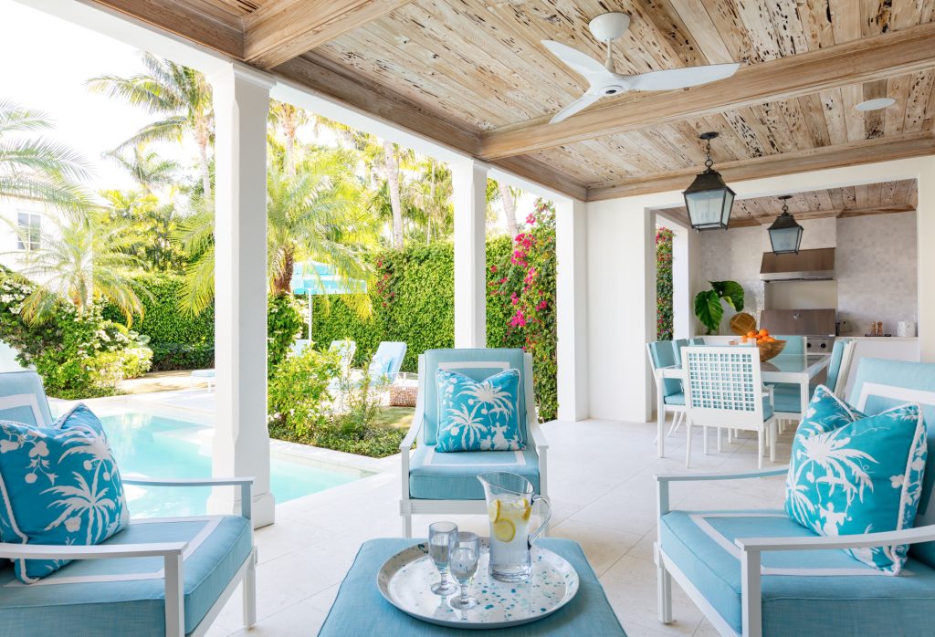 Inspiration for a tropical patio kitchen remodel in Miami with a roof extension