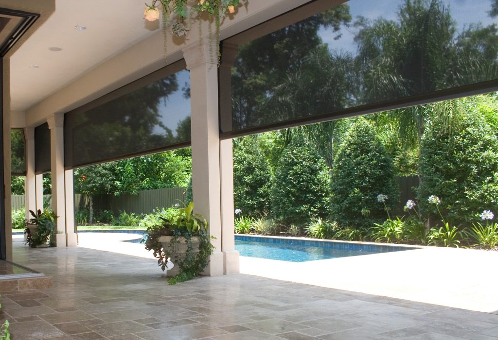 Island style screened-in back porch photo in Other with a roof extension by PHANTOM RETRACTABLE SCREENS | Outdoor Photos | Porch | Landscaping | Landscape Design | Outdoor Living Space | Porch Design Ideas | Outdoor Living Space Ideas | Backyard Design