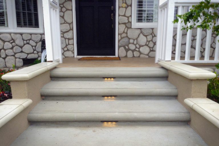 LED step lights add to the safety and presentation of the front porch steps. They are low voltage and long lasting exterior landscape lights. The porch is made of ceramic tile. TRU Landscape Services by TRU Landscape Services | Outdoor Photos | Porch | Landscaping | Landscape Design | Outdoor Living Space | Porch Design Ideas | Outdoor Living Space Ideas | Backyard Design