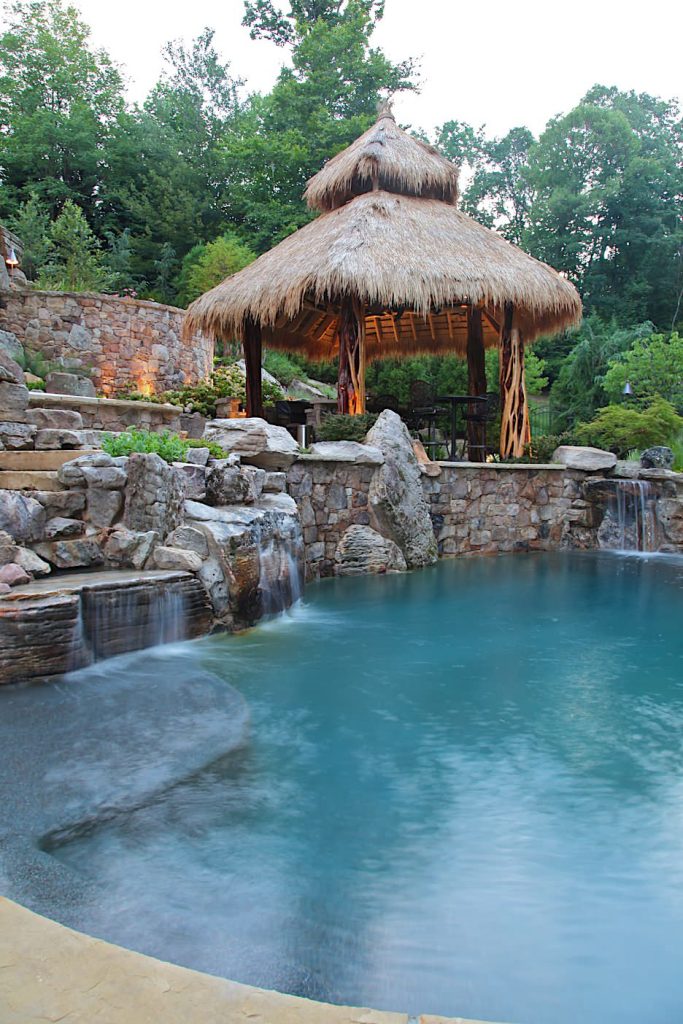 Landscape Architect: Howard Cohen Photography by: Brandon Rossen Pool finish is PebbleSheen Ocean Blue.