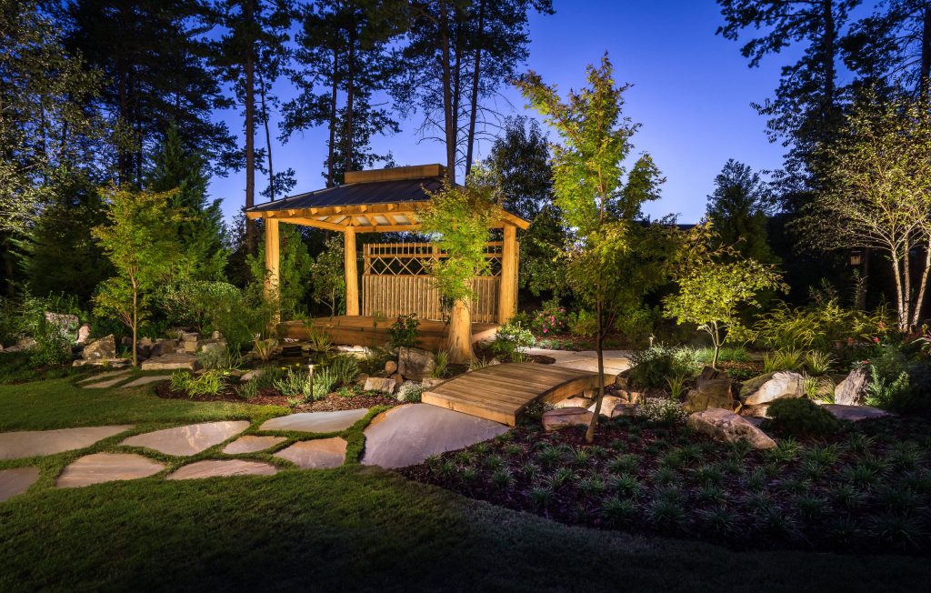 Landscape lighting is used to enhance the evening experience.