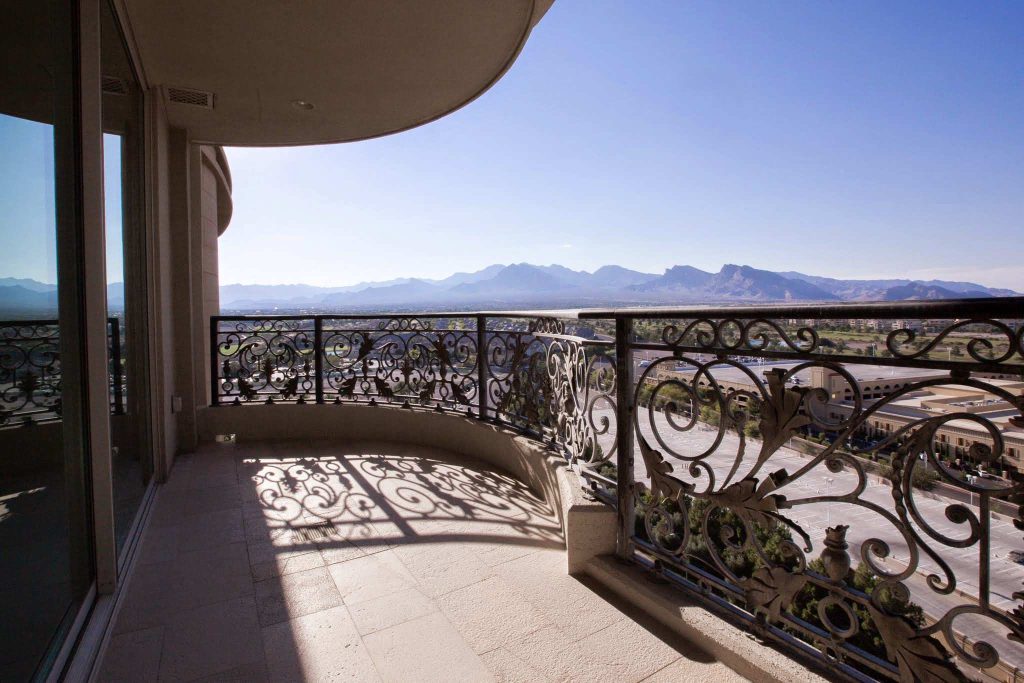 Large 1960s stone side porch idea in Las Vegas with an awning by One Queensridge Place | Outdoor Photos | Porch | Landscaping | Landscape Design | Outdoor Living Space | Porch Design Ideas | Outdoor Living Space Ideas | Backyard Design