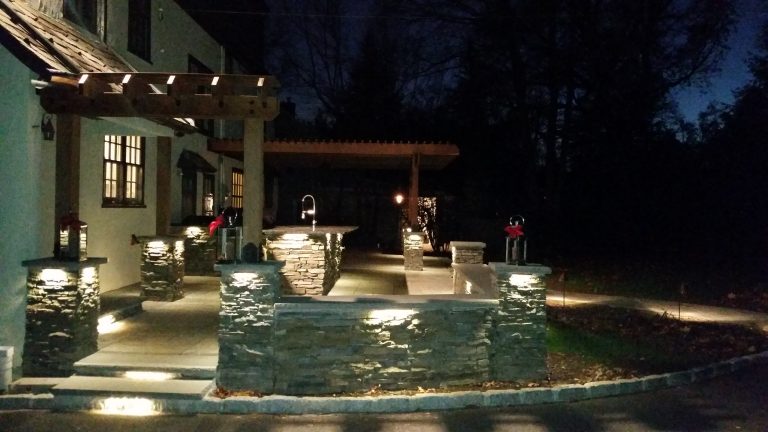 Large arts and crafts backyard tile patio kitchen photo in New York with a pergola