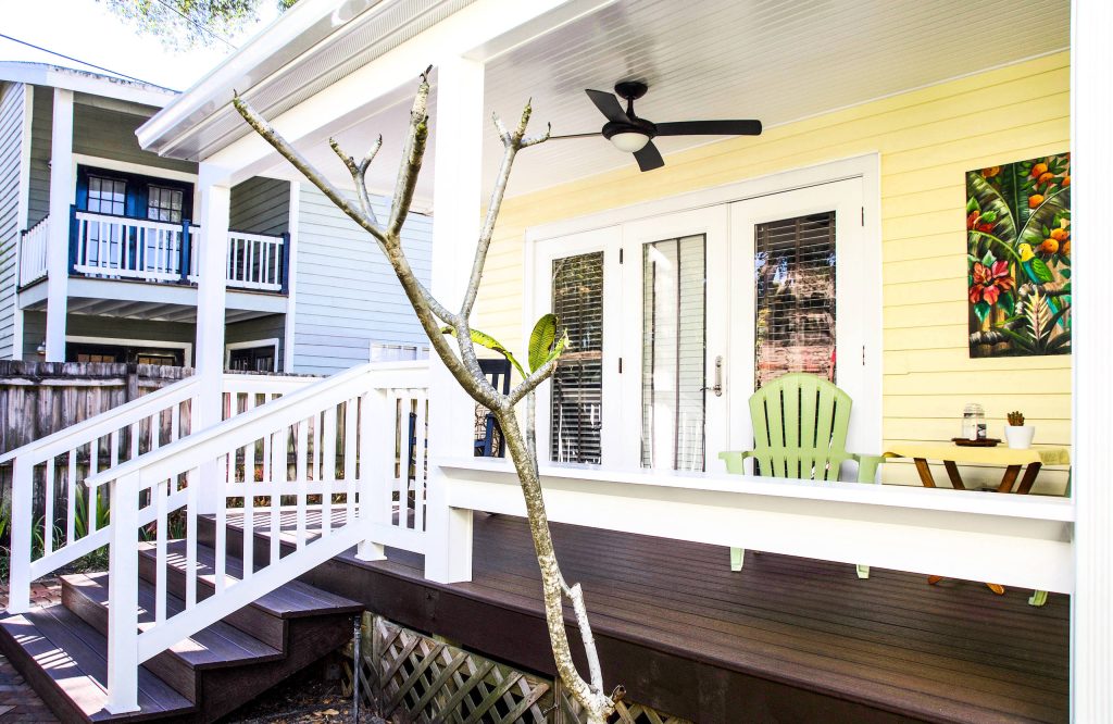 Large arts and crafts front porch idea in Tampa with decking and a roof extension by Voss Builders | Outdoor Photos | Porch | Landscaping | Landscape Design | Outdoor Living Space | Porch Design Ideas | Outdoor Living Space Ideas | Backyard Design