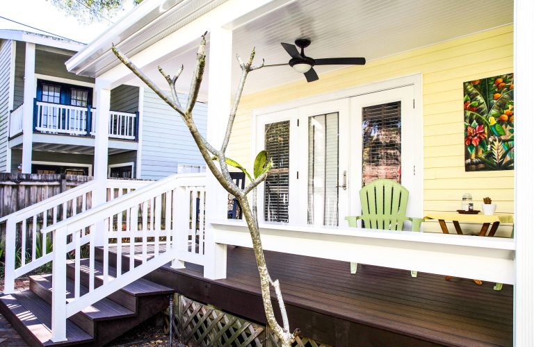 Large arts and crafts front porch idea in Tampa with decking and a roof extension by Voss Builders | Outdoor Photos | Porch | Landscaping | Landscape Design | Outdoor Living Space | Porch Design Ideas | Outdoor Living Space Ideas | Backyard Design