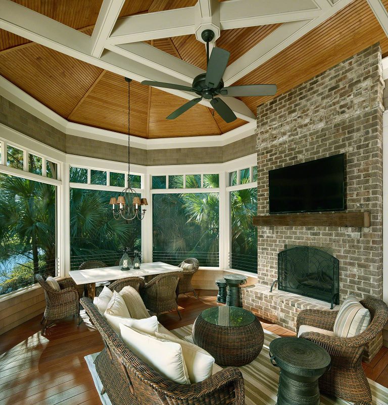 Large arts and crafts porch idea in Charleston with a roof extension