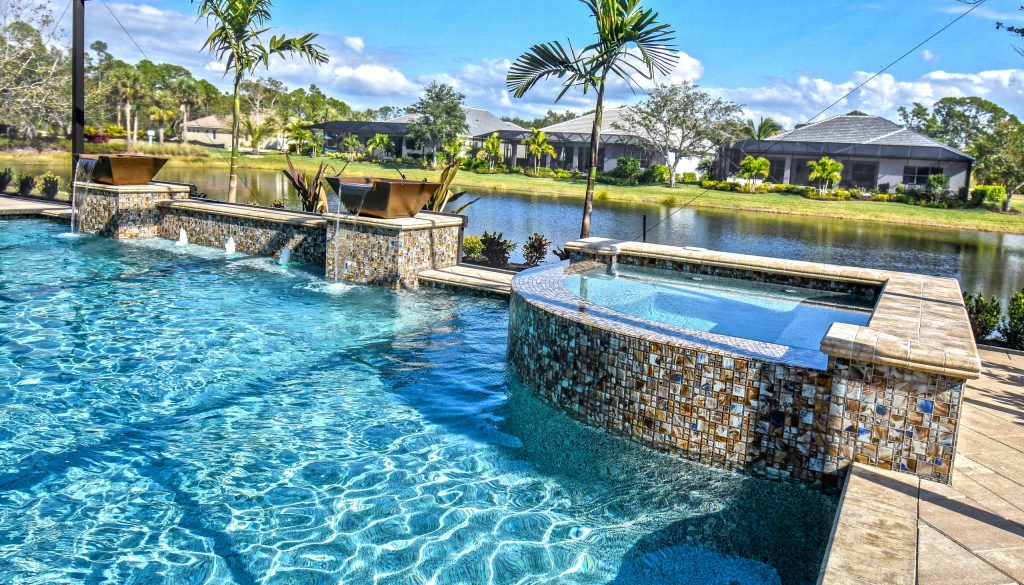 Large backyard hot tub photo in Tampa with decking