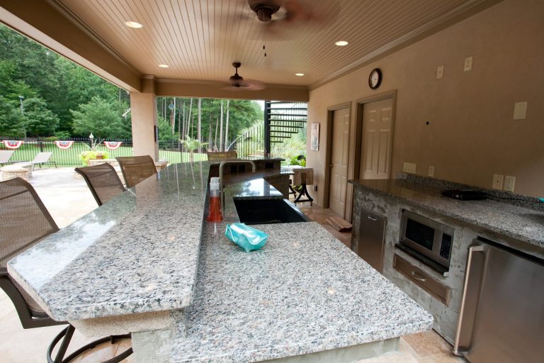 Large backyard patio kitchen photo in Atlanta