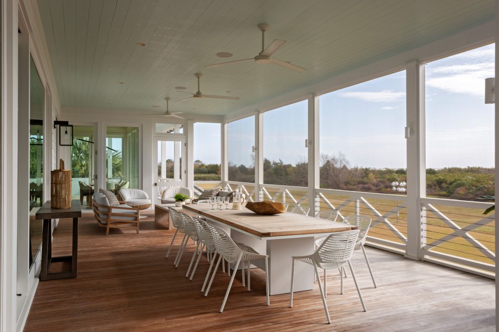 Large beach style back porch photo in Charleston with a roof extension by Beau Clowney Architects | Outdoor Photos | Porch | Landscaping | Landscape Design | Outdoor Living Space | Porch Design Ideas | Outdoor Living Space Ideas | Backyard Design