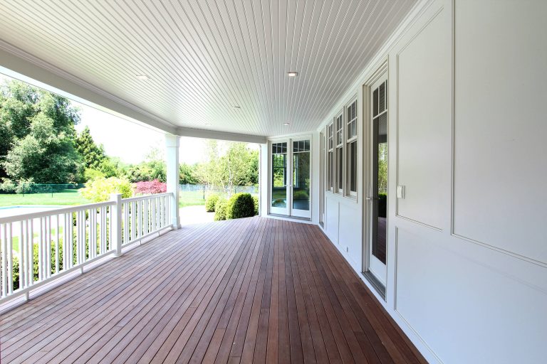Large beach style back porch photo in New York with decking and a roof extension by Heartwood Corp | Outdoor Photos | Porch | Landscaping | Landscape Design | Outdoor Living Space | Porch Design Ideas | Outdoor Living Space Ideas | Backyard Design