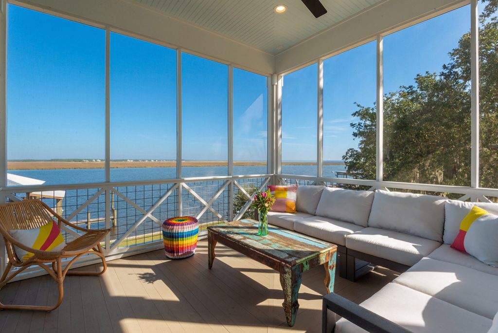 Large beach style screened-in and mixed material railing side porch idea in New Orleans with decking and a roof extension by Crane Builders LLC | Outdoor Photos | Porch | Landscaping | Landscape Design | Outdoor Living Space | Porch Design Ideas | Outdoor Living Space Ideas | Backyard Design