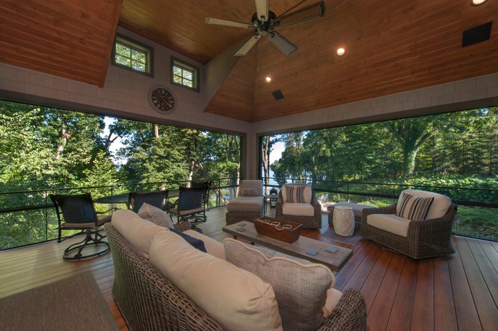 Large beach style screened-in back porch photo in Minneapolis with decking and a roof extension by | Outdoor Photos | Porch | Landscaping | Landscape Design | Outdoor Living Space | Porch Design Ideas | Outdoor Living Space Ideas | Backyard Design