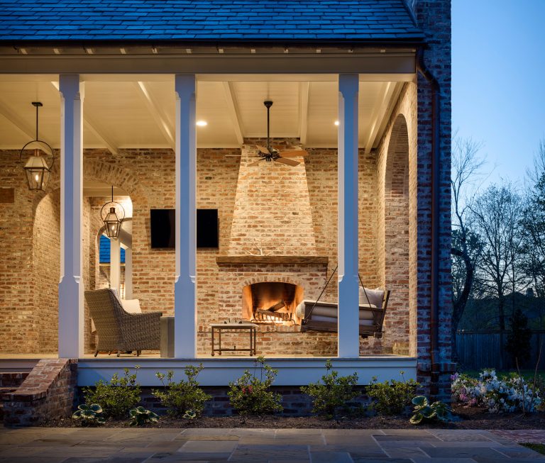 Large classic back porch idea in New Orleans with a fireplace and a roof extension by Patin Construction Group, LLC | Outdoor Photos | Porch | Landscaping | Landscape Design | Outdoor Living Space | Porch Design Ideas | Outdoor Living Space Ideas | Backyard Design