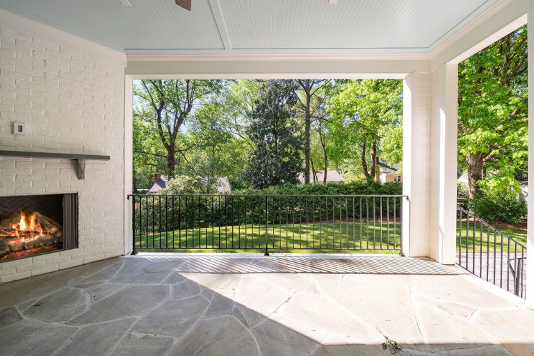 Large classic brick back porch idea in Raleigh with a fireplace and a roof extension by Cambridge Classic Homes | Outdoor Photos | Porch | Landscaping | Landscape Design | Outdoor Living Space | Porch Design Ideas | Outdoor Living Space Ideas | Backyard Design