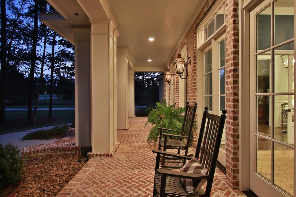 Large classic brick front porch idea in Houston with a roof extension by Wyrick Residential Design | Outdoor Photos | Porch | Landscaping | Landscape Design | Outdoor Living Space | Porch Design Ideas | Outdoor Living Space Ideas | Backyard Design
