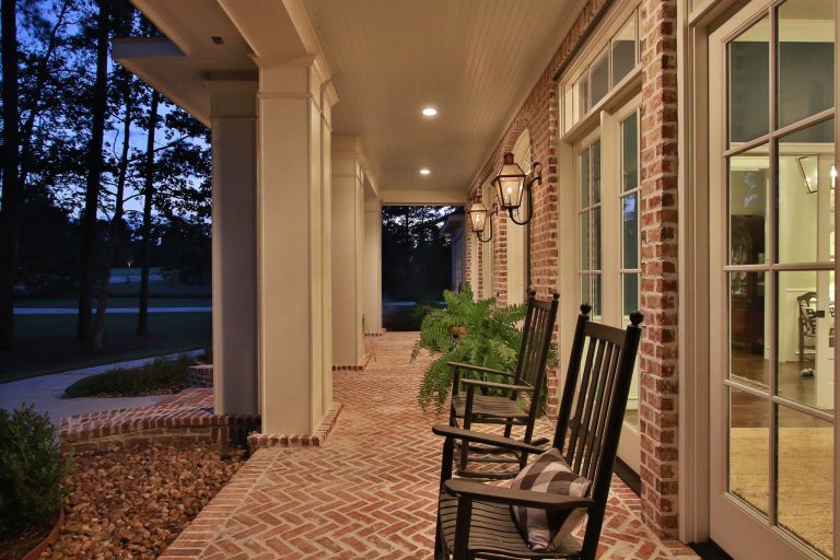 Large classic brick front porch idea in Houston with a roof extension by Wyrick Residential Design | Outdoor Photos | Porch | Landscaping | Landscape Design | Outdoor Living Space | Porch Design Ideas | Outdoor Living Space Ideas | Backyard Design