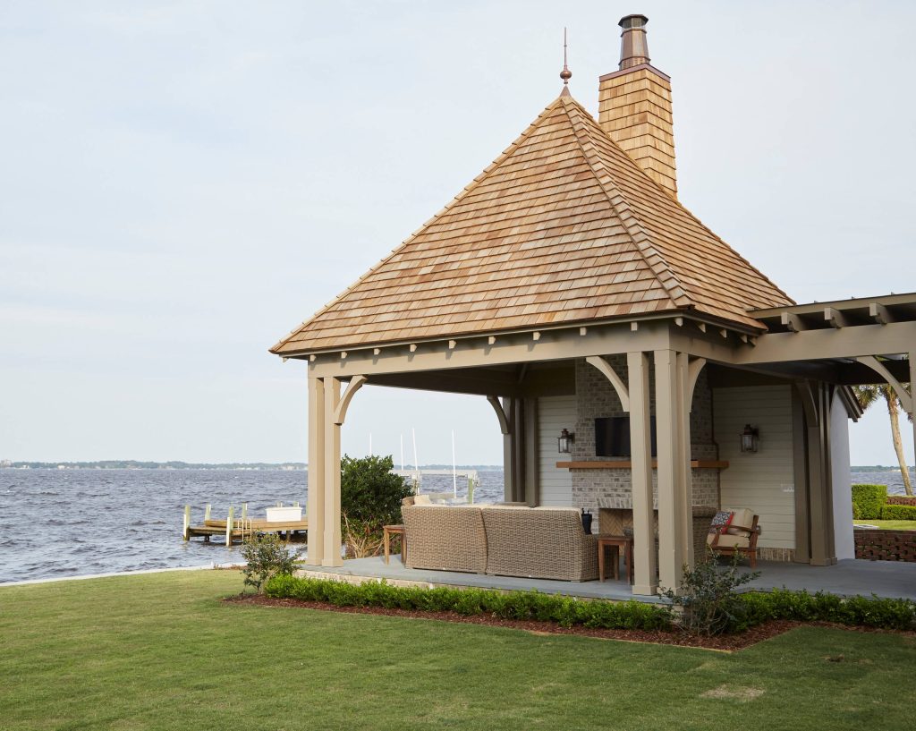 Large classic concrete paver back porch idea in Jacksonville with a fire pit by Morales Construction Co., Inc. | Outdoor Photos | Porch | Landscaping | Landscape Design | Outdoor Living Space | Porch Design Ideas | Outdoor Living Space Ideas | Backyard Design