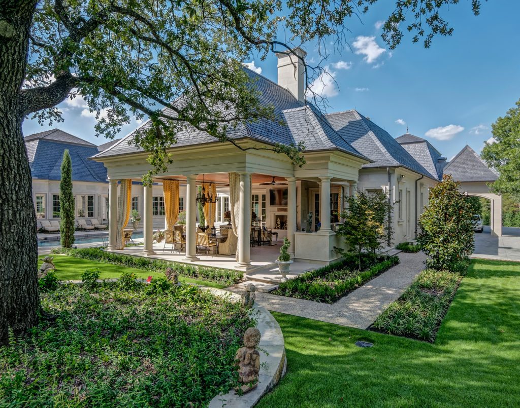 Large classic stone back porch idea in Dallas with a roof extension by Richard Drummond Davis Architects | Outdoor Photos | Porch | Landscaping | Landscape Design | Outdoor Living Space | Porch Design Ideas | Outdoor Living Space Ideas | Backyard Design