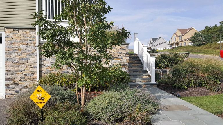 Large classic stone front porch idea in New York with a roof extension by Castro StoneWorks NY - Masonry Contractors | Outdoor Photos | Porch | Landscaping | Landscape Design | Outdoor Living Space | Porch Design Ideas | Outdoor Living Space Ideas | Backyard Design