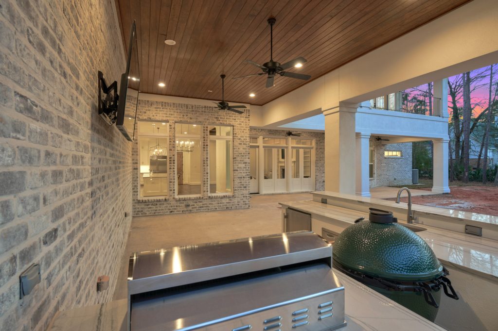 Large concrete porch photo in Houston with a roof extension by Wyrick Residential Design | Outdoor Photos | Porch | Landscaping | Landscape Design | Outdoor Living Space | Porch Design Ideas | Outdoor Living Space Ideas | Backyard Design