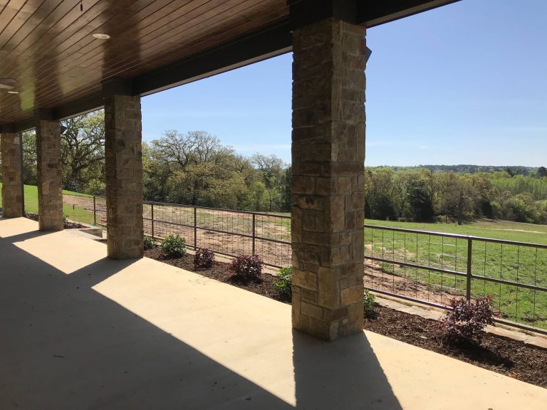 Large cottage backyard concrete patio kitchen photo in Dallas with a roof extension