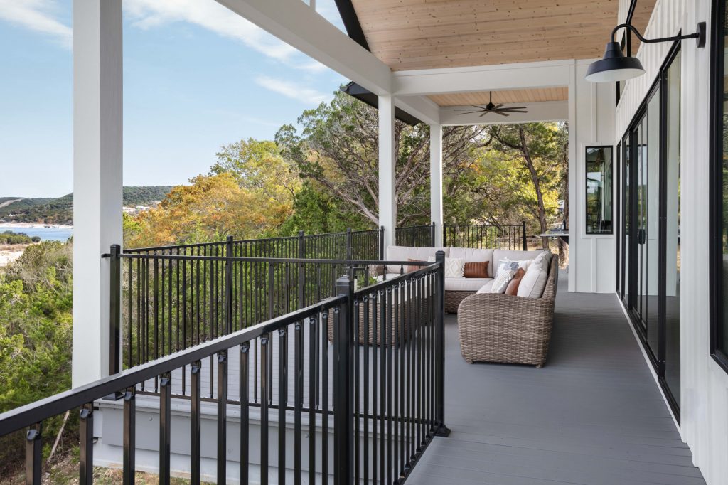 Large cottage backyard patio kitchen photo in Austin with decking and a roof extension