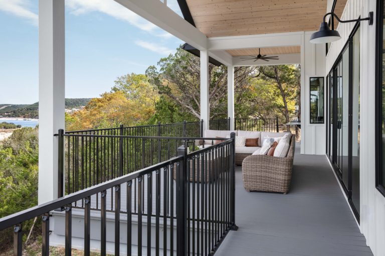 Large cottage backyard patio kitchen photo in Austin with decking and a roof extension