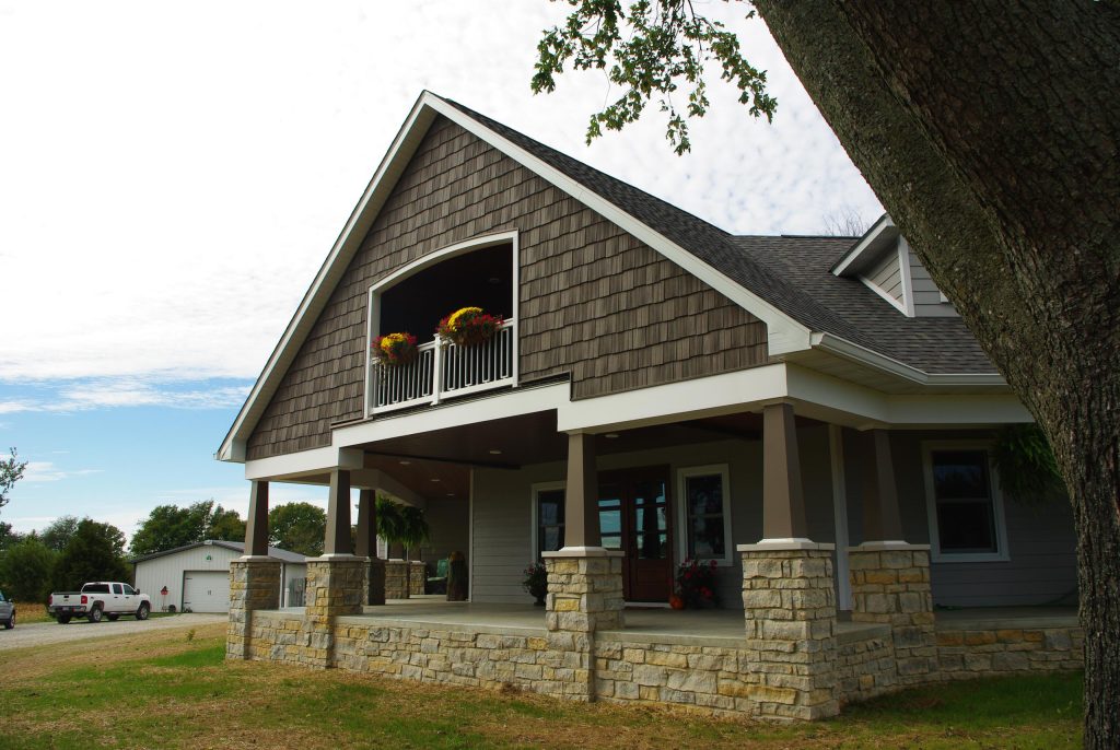 Large cottage concrete paver front porch photo in St Louis with a roof extension by Architecturally Designed Cabinetry Inc. | Outdoor Photos | Porch | Landscaping | Landscape Design | Outdoor Living Space | Porch Design Ideas | Outdoor Living Space Ideas | Backyard Design