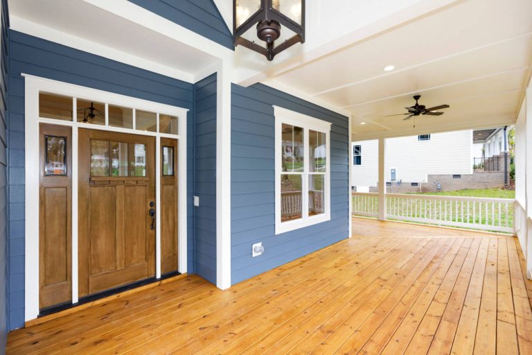 Large cottage front porch photo in Raleigh with decking and a roof extension by Paragon Building Group | Outdoor Photos | Porch | Landscaping | Landscape Design | Outdoor Living Space | Porch Design Ideas | Outdoor Living Space Ideas | Backyard Design